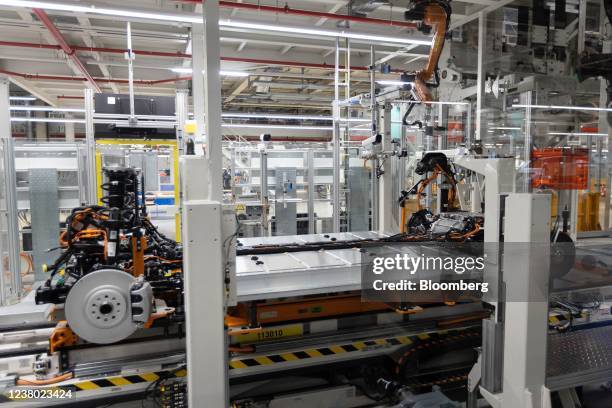 The chassis and battery pack of a Volkswagen AG ID.5 electric sports utility vehicle on the assembly line during a media tour of the automaker's...