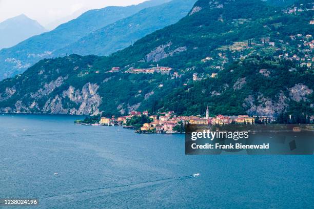 Aerial view from Menaggio on the town across Lake Como, hill slopes with villages in the distance.