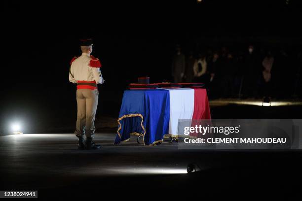 French Army 54th artillery regiment soldier pays tribute in front of the coffin of French brigadier-chief Alexandre Martin killed in Mali by a mortar...