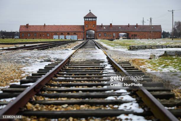 Railroad track and the Gate of Death, the main entrance at the former Nazi-German Auschwitz II-Birkenau concentration and extermination camp during...