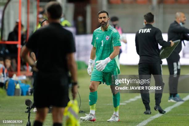 Chile's goalkeeper Claudio Bravo leaves the field after an injury during the South American qualification football match for the FIFA World Cup Qatar...