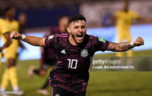 Mexico's Alexis Vega celebrates after scoring against Jamaica during the Central American qualifiers football match between Jamaica and Mexico for...