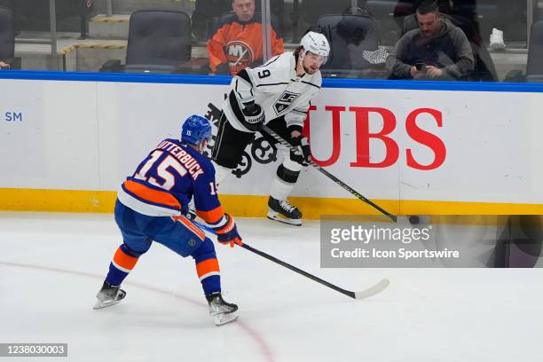 Los Angeles Kings Right Wing Adrian Kempe \sc with New York Islanders Right Wing Cal Clutterbuck defending during the third period of the National...