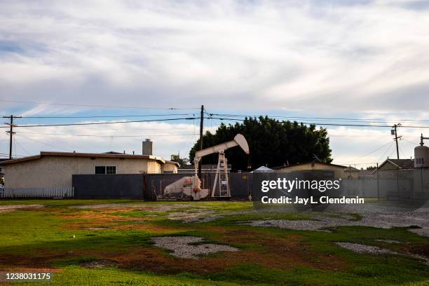 Los Angeles, CA An Oil derrick pump is seen on a property, adjacent to homes, along W R Street, at Frigate Avenue, in the Wilmington neighborhood of...