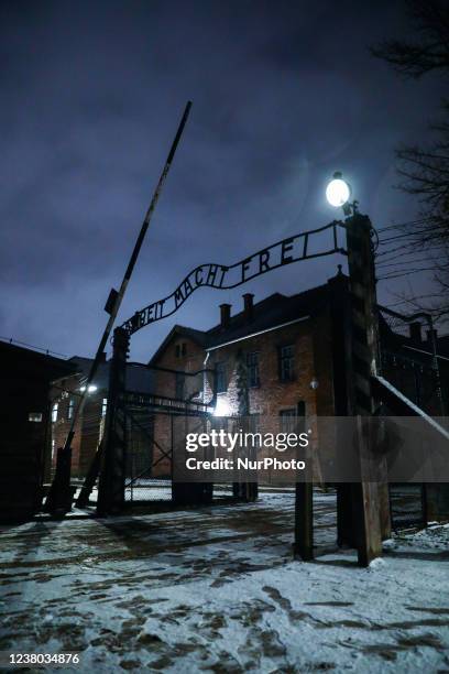 The entrance gate with 'Arbeit Macht Frei' inscription in the former Nazi German Auschwitz I concentration camp at Auschwitz Memorial Site during...