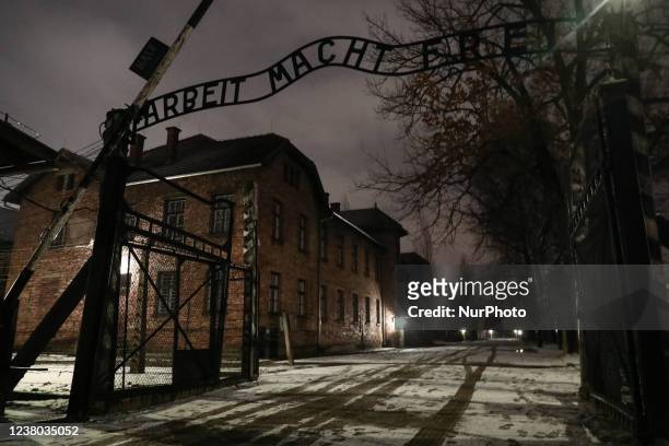 The entrance gate with 'Arbeit Macht Frei' inscription in the former Nazi German Auschwitz I concentration camp at Auschwitz Memorial Site during...