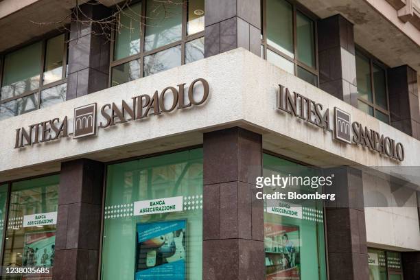 An Intesa Sanpaolo SpA logo above the entrance to an Intesa Sanpaolo bank branch in Brescia, Italy, on Tuesday Jan. 25, 2022. Intesa Sanpaolo will...
