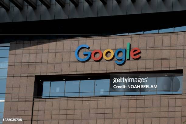 The Google logo is pictured at the Google India office building in Hyderabad on January 28, 2022. - Google will invest up to $1 billion in India's...