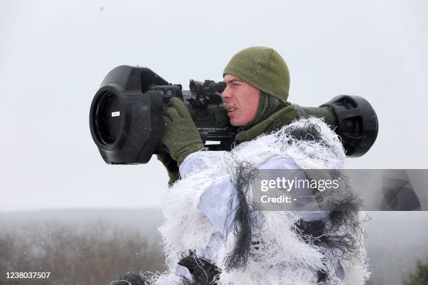 Ukrainian Military Forces serviceman aims with a Next generation Light Anti-tank Weapon Swedish-British anti-aircraft missile launcher during a drill...