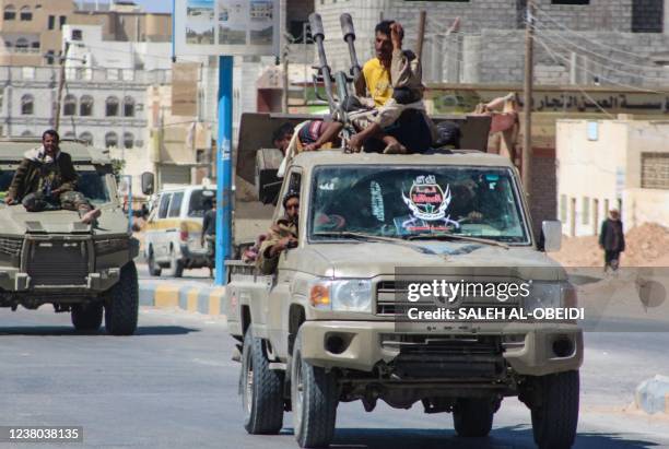 Yemeni pro-government fighters from the UAE-trained Giants Brigade, drive trhough Ataq city, east of the Red Sea port of Aden, on their way to the...