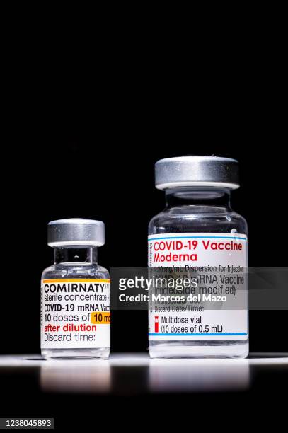 In this photo illustration a vial of COMIRNATY and a vial of Moderna vaccines for coronavirus treatment.