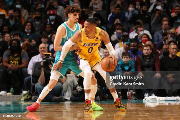 LaMelo Ball of the Charlotte Hornets plays defense on Russell Westbrook of the Los Angeles Lakers during the game on January 28, 2022 at Spectrum...