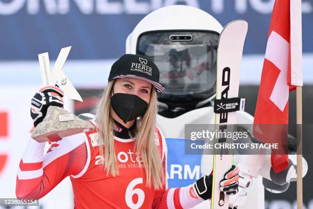Third placed Austria's Cornelia Huetter celebrates winning the women's downhill event at the FIS Alpine Ski World Cup in Garmisch-Partenkirchen,...