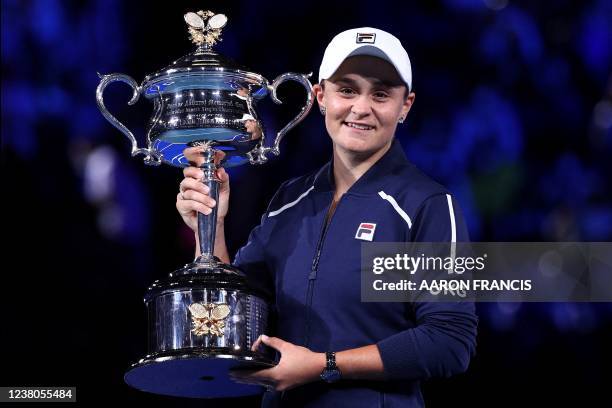 Australia's Ashleigh Barty holds her trophy following her victory in the women's singles final match against Danielle Collins of the US on day...