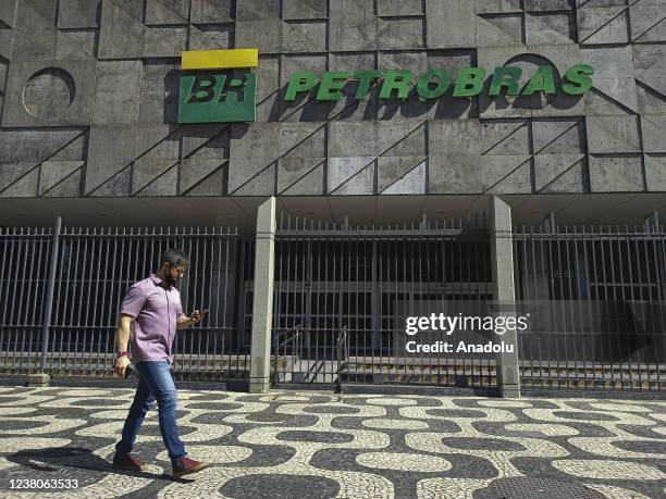 Man walks past the headquarters of Brazilian Oil Company, Petrobras as gasoline price hiked in Rio de Janeiro, Brazil on January 28, 2022. The poor...