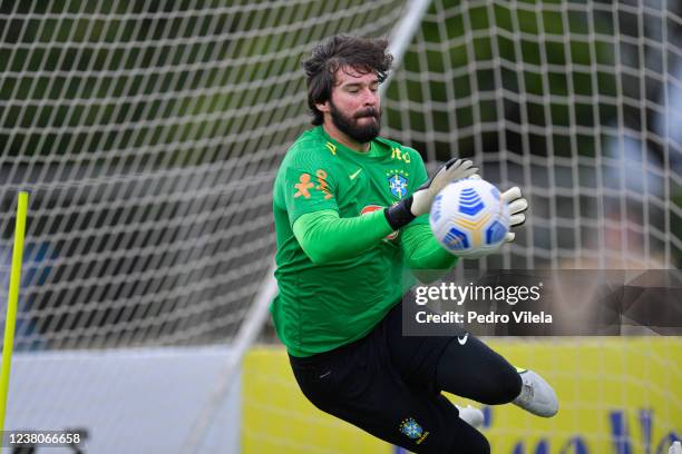 Alisson goalkeeper of Brazil makes a save during a training session at Toca da Raposa II on January 29, 2022 in Belo Horizonte, Brazil. Brazil faces...