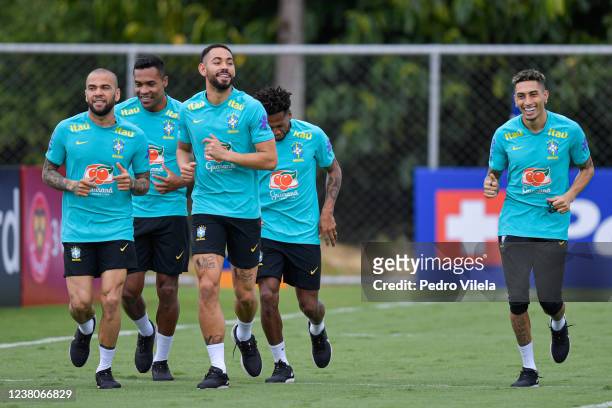 Dani Alves of Brazil and teammates run during a training session at Toca da Raposa II on January 29, 2022 in Belo Horizonte, Brazil. Brazil faces...