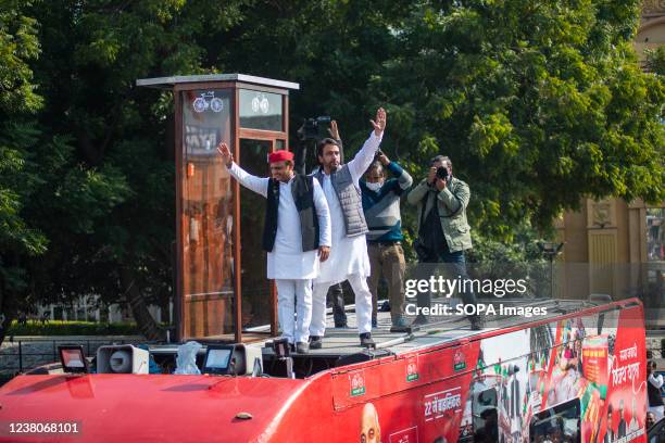 Akhilesh Yadav and Jayant Chaudhary wave at the party supporters during their joint road show for the upcoming assembly election 2022 in Ghaziabad....