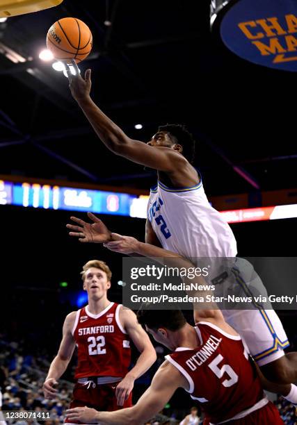 Los Angeles, CA Cody Riley of the UCLA Bruins drives to the basket against Michael O'Connell of the Stanford Cardinal in the first half of a NCAA...