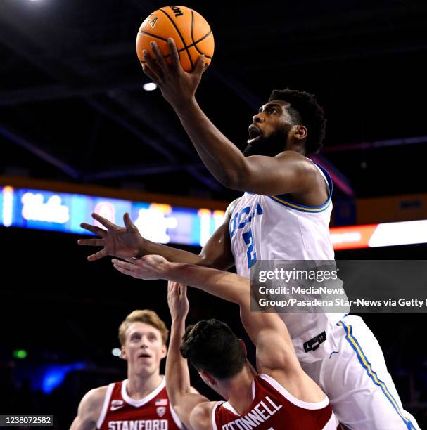 Los Angeles, CA Cody Riley of the UCLA Bruins drives to the basket over Michael O'Connell of the Stanford Cardinal in the first half of a NCAA...