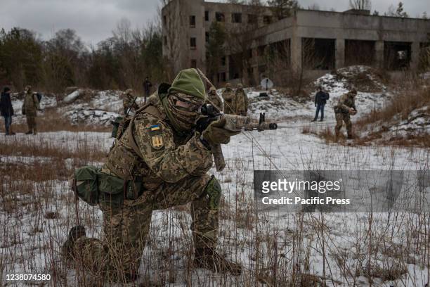 Ukrainian reservist take part in training with "Territorial Defense Forces just outside the capital city of Kyiv as Russian military forces continue...