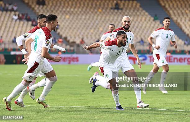 Morocco's forward Sofiane Boufal celebrates after scoring a penalty kick during the Africa Cup of Nations 2021 quarter-final football match between...