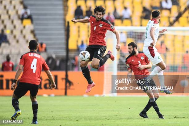 Egypt's defender Ahmed Hegazi and Egypt's defender Omar Kamal fight for the ball with Morocco's forward Sofiane Boufal during the Africa Cup of...