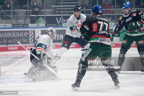 Goalkeeper Niklas Treutle of Nuernberg Ice Tigers, Oliver Mebus of Nuernberg Ice Tigers, Colin Campbell of Augsburger Panthers and Adam Payerl of...