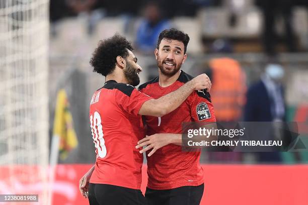 Egypt's midfielder Mahmoud 'Trezeguet' Hassan celebrates with Egypt's forward Mohamed Salah after scoring his team's second goal during the Africa...