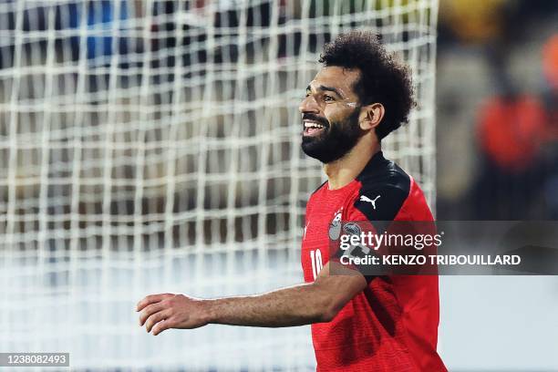 Egypt's forward Mohamed Salah reacts during the Africa Cup of Nations 2021 quarter-final football match between Egypt and Morocco at Stade Ahmadou...