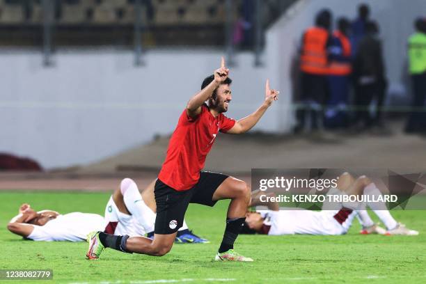 Egypt's midfielder Mahmoud 'Trezeguet' Hassan celebrates after winning the Africa Cup of Nations 2021 quarter-final football match between Egypt and...