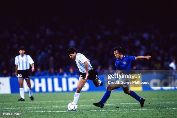 Jorge Burruchaga of Argentina and Giuseppe Giannini of Italy during the FIFA World Cup Semi-Final match between Argentina and Italy, at Stadio San...