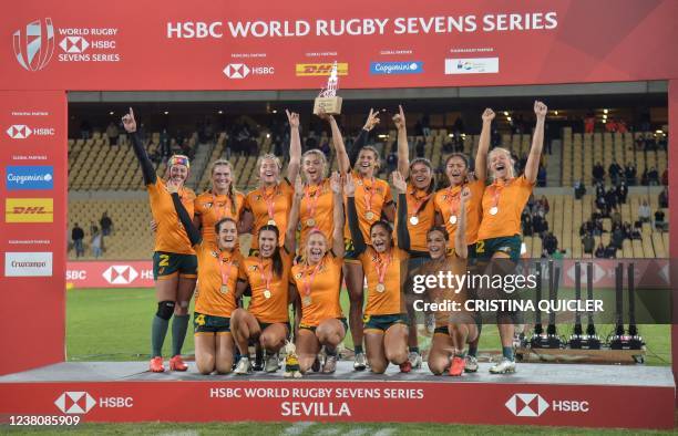 Australia's Women team players pose for pictures with the gold medals during the podium ceremony after the HSBC World Rugby Sevens 2022 Final matches...