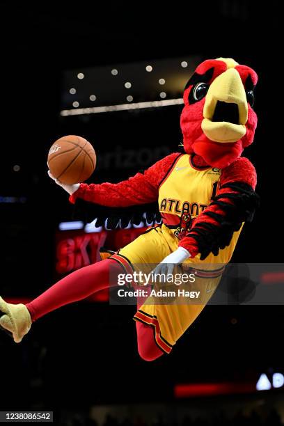 The Atlanta Hawks mascot, Harry the Hawk, dunks the ball during a time out during the game against the Los Angeles Lakers on January 30, 2022 at...