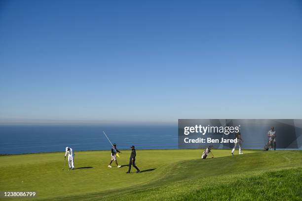 Wyatt Worthington II, Willie Mack III and Aaron Beverly play the fourth green during the final round of the APGA Tour at Farmers Insurance Open at...