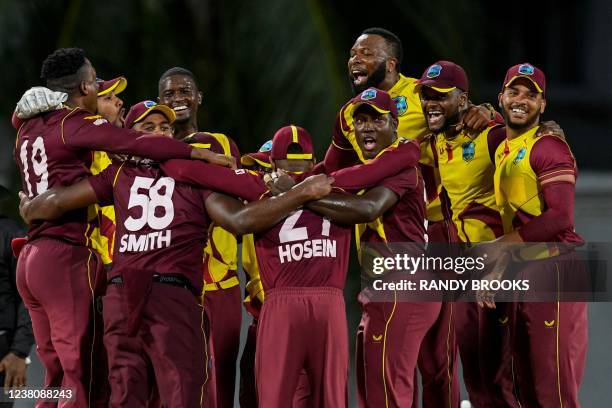 Kieron Pollard , Rovman Powell , Romario Shepherd , Brandon King and Jason Holder of West Indies celebrate after winning the 5th and final T20I...
