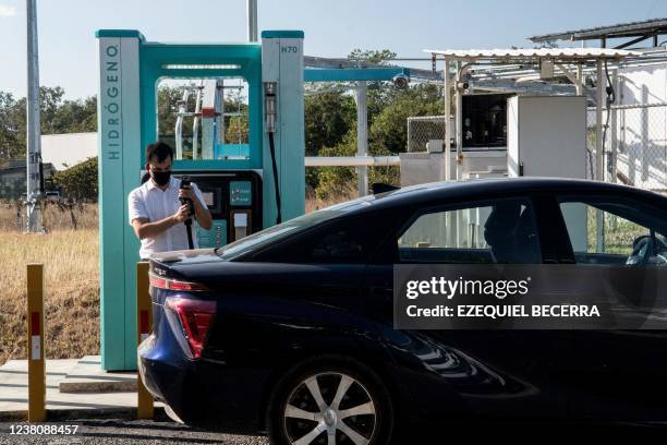 Man fills the tank of his car with hydrogen at a station of the Ad Astra Rocket Company in Guanacaste, Costa Rica, on January 19, 2022. - Former...