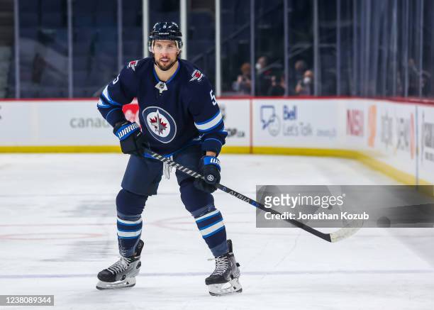 Brenden Dillon of the Winnipeg Jets keeps an eye on the play during first period action against the Florida Panthers at Canada Life Centre on January...