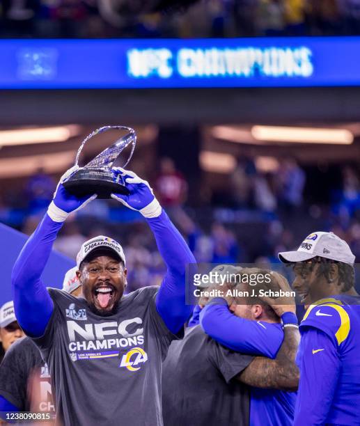 Los Angeles, CA Rams line backer Von Miller hoists the NFC Championship trophy after the Rams 20-17 victory over the San Francisco 49ers in the NFC...