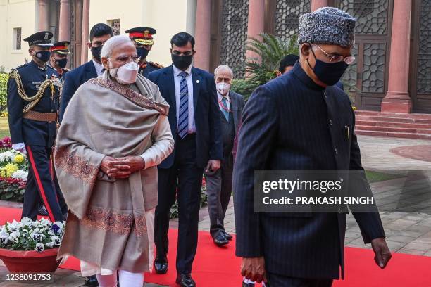 India's Prime Minister Narendra Modi and President Ram Nath Kovind and Parliament's Lok Sabha Speaker Om Birla arrive at the Parliament for the...