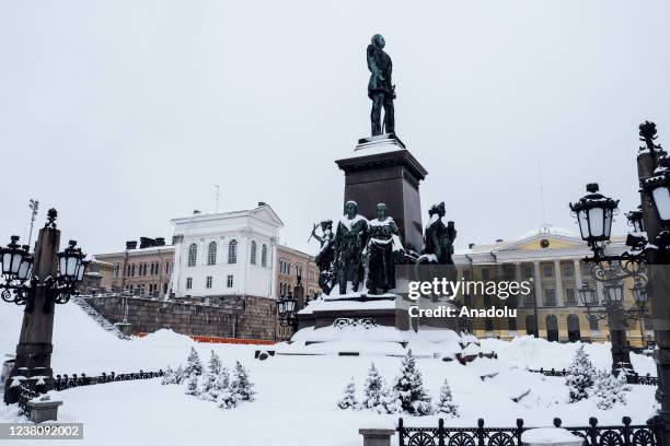 View of Alexander II statue and Senaatintori square after heavy snowfall in Helsinki, Finland on January 30, 2022.