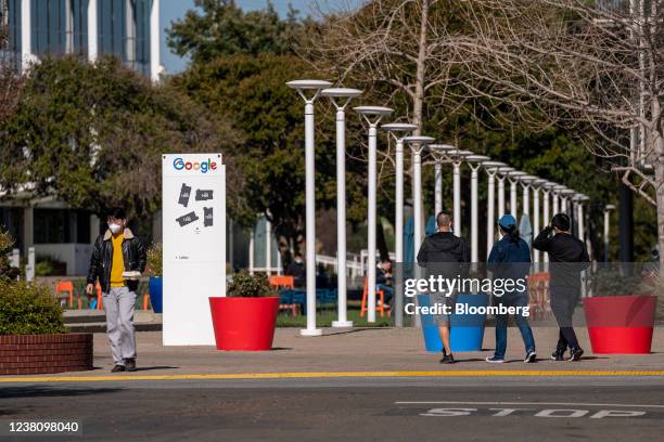 Pedestrians walk on the Google campus at the company's headquarters in Mountain View, California, U.S., on Thursday, Jan. 27, 2022. Alphabet Inc. Is...