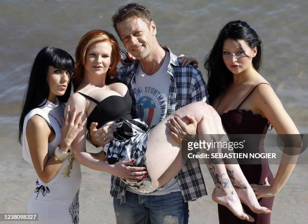 Porn Movie actors, Jade Laroche, Tarra White, Rocco Siffredi and Anna Polina pose during a photocall on April 5, 2011 in Cannes, southern France,...