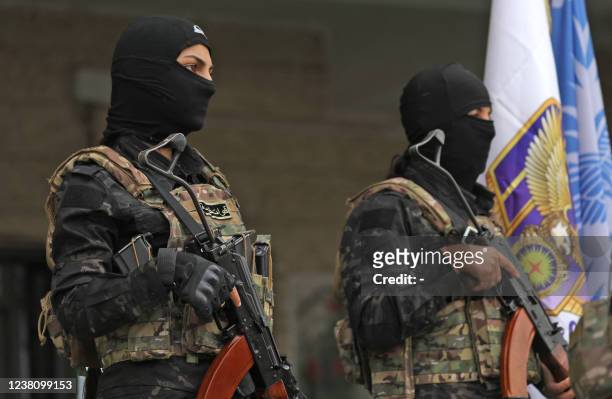 Syrian Democratic Forces fighters stand guard during a press conference in Syria's northeastern city of Hasakeh in which the SDF said the Ghwayran...