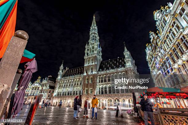 Panoramic night view with the illuminated historic picturesque buildings of Grand Place square in the Belgian capital. The Grand Place - Grand Square...