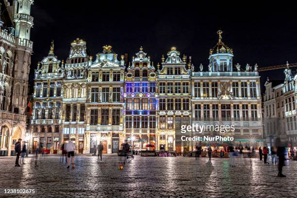 Panoramic night view with the illuminated historic picturesque buildings of Grand Place square in the Belgian capital. The Grand Place - Grand Square...