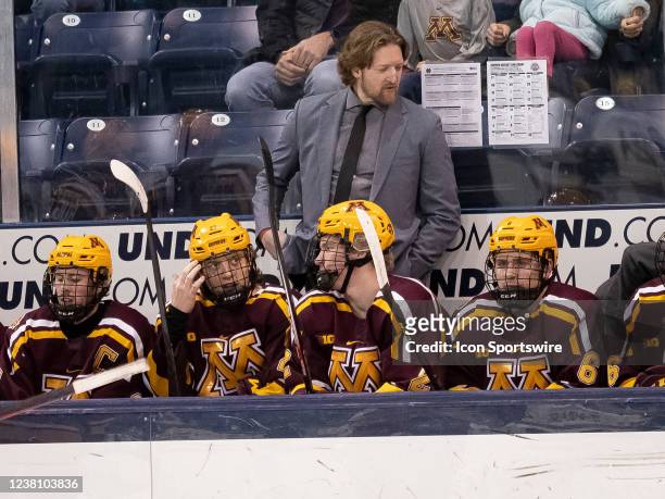 Minnesota Golden Gophers graduate assistant coach Paul Martin communicates with his players during a men's college hockey game between the Minnesota...