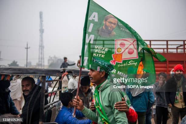 Supporter seen holding a party flag at Dasna Ghaziabad. All India Majlis-e-Ittehadul Muslimeen party will contest the elections on 100 out of 403...