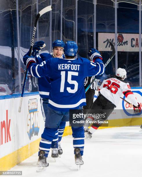 Ilya Mikheyev of the Toronto Maple Leafs celebrates his goal with teammates Alexander Kerfoot during the third period against the New Jersey Devils...