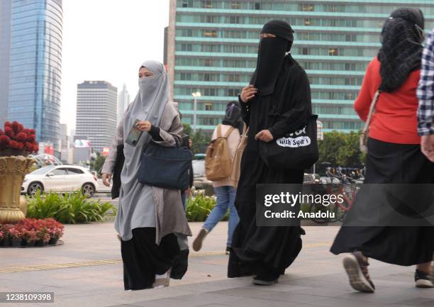 Group of women wearing hijabs walk enjoying the city atmosphere while walking on the pedestrian street of Jalan Thamrin, Jakarta, on January 31,...